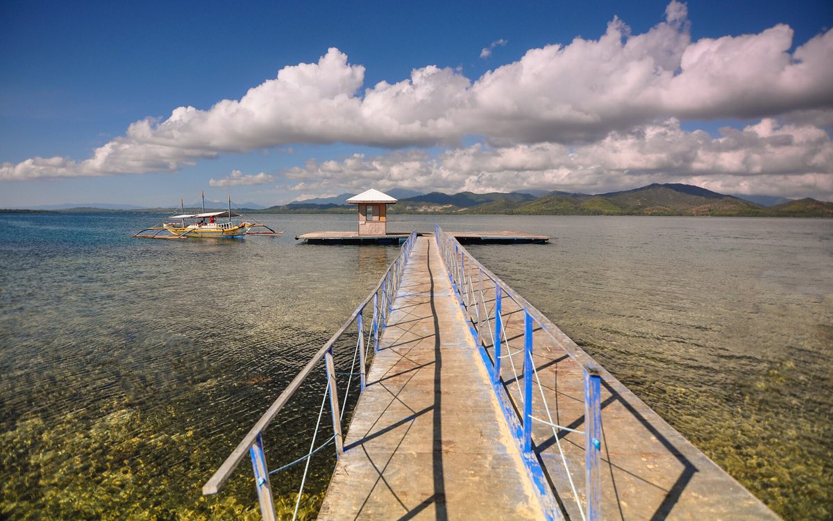 The jetty and shallow turquoise water at Luli Island, Honda Bay