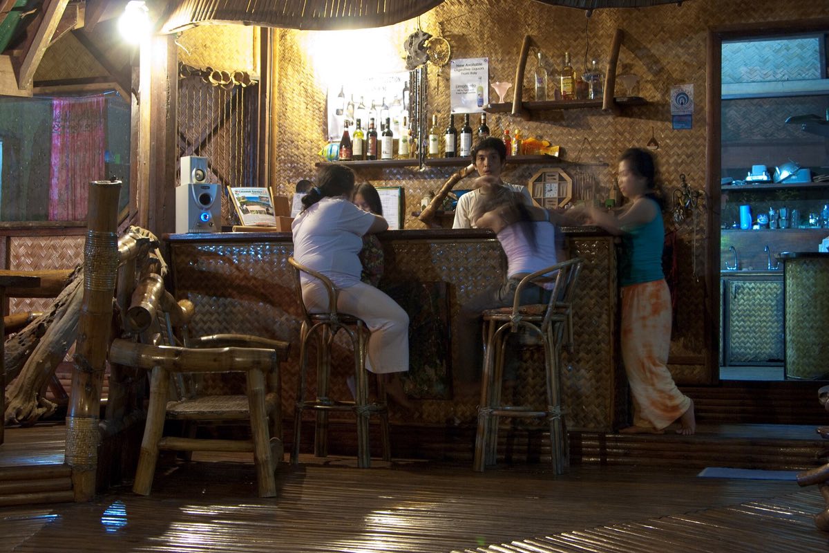 A beach bar at night in Sabang, Palawan