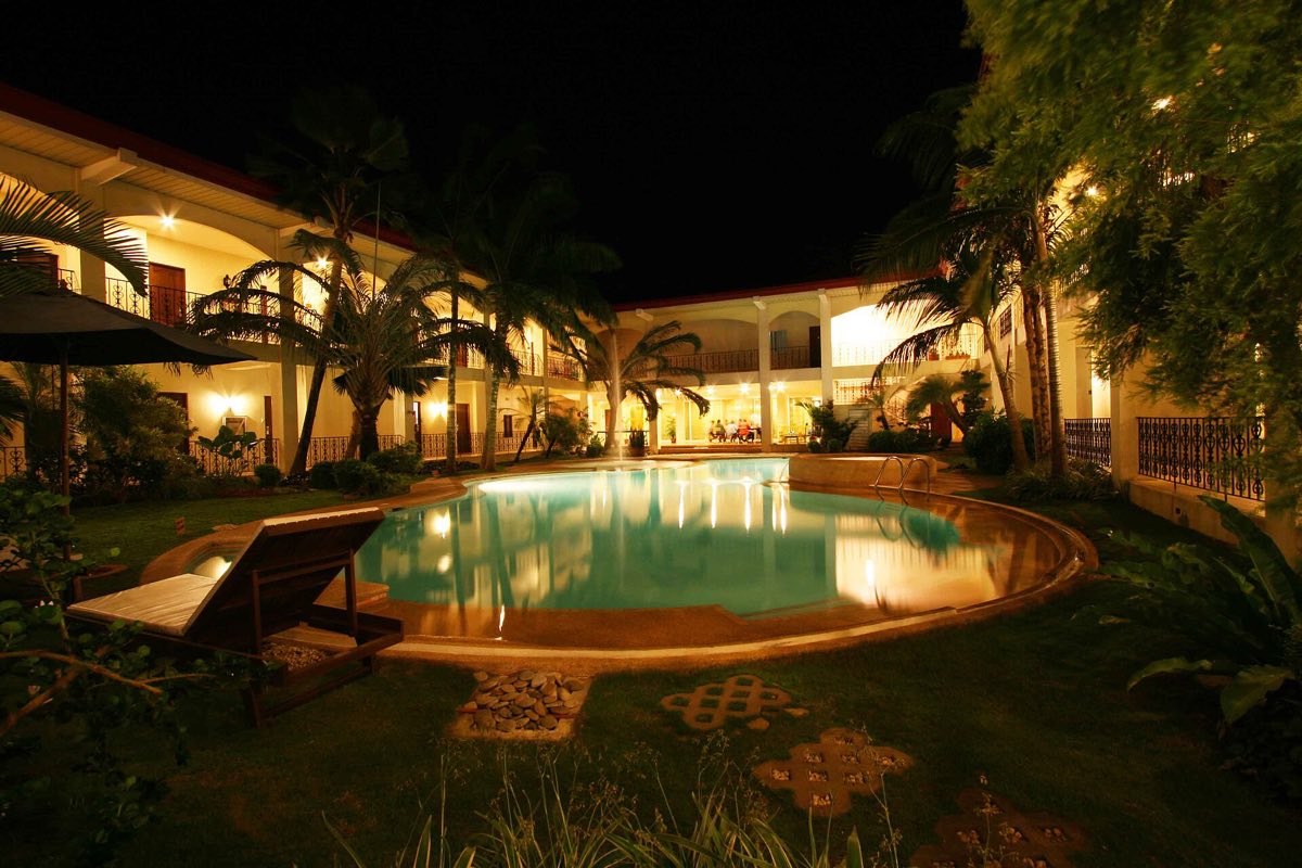 A hotel pool at night in Palawan